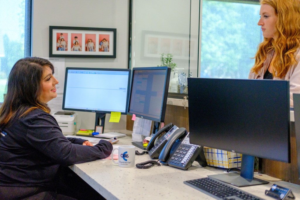 front desk helping patient