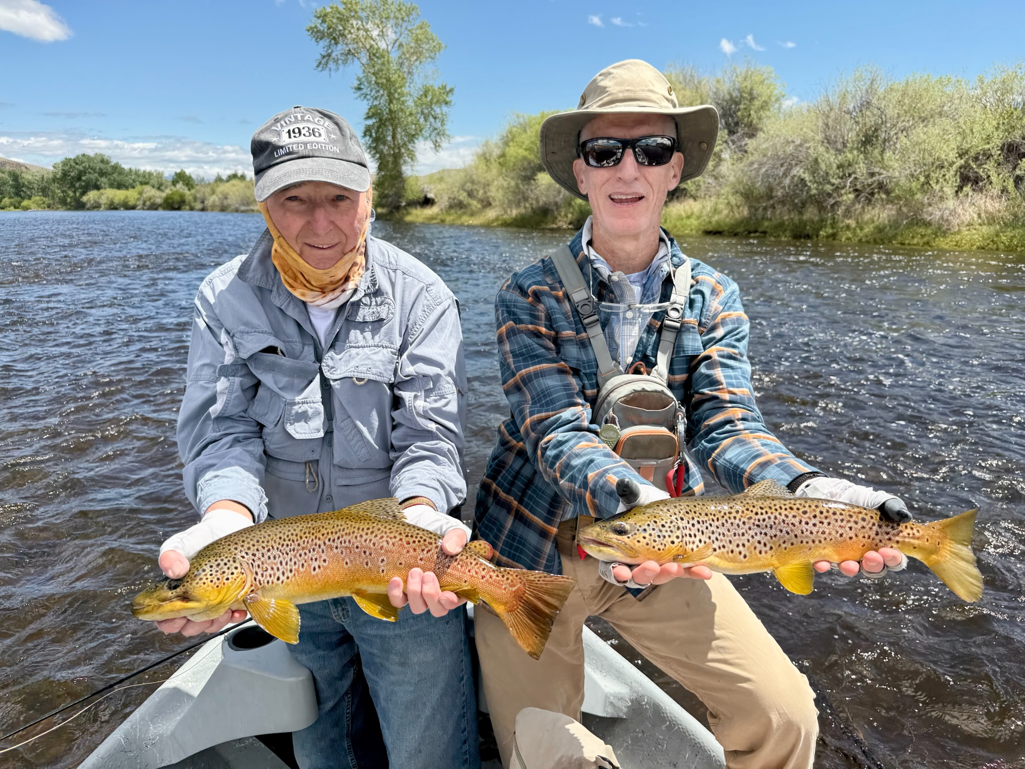 posing with caught fish